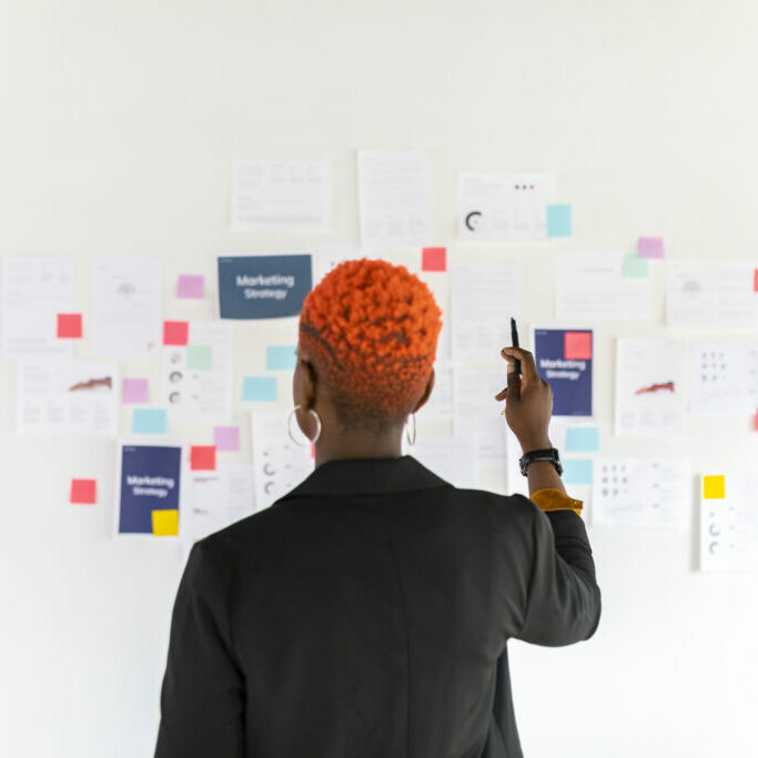Cool black businesswoman planning a marketing strategy Cool black businesswoman planning a marketing strategy